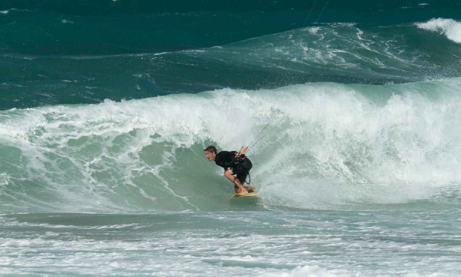 Trimming for the tunnel in short period wind swell. // Photo Gary Strachan